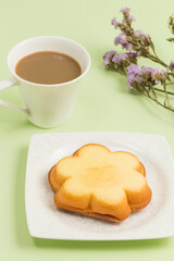 Coffee and a snack with a smiley face on it