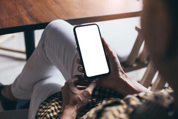 cell phone blank white screen mockup.woman hand holding texting using mobile on desk at office.background empty space for advertise.work people contact marketing business,technology