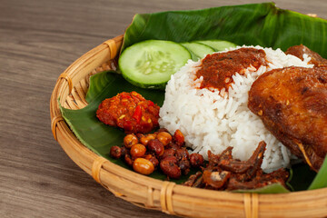 Nasi Kukus is a traditional delicacy originally from the East Coast of Peninsular Malaysia....