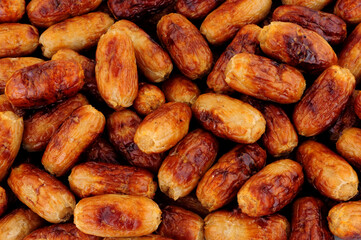 Oven baked pork cocktail party sausages background