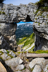 Window In Rock Wall With View To Alpine Landscape On Mountain Loser In The Alps Of Austria