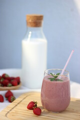 A glass of strawberry smootie