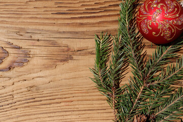 christmas composition with branches of christmas tree on wooden background