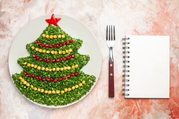 top view green salad in new year tree shape inside plate on the light background salad meal color xmas photo