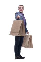 Picture of handsome smiling man in suit with shopping bags