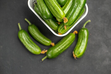top view fresh green cucumbers inside basket on dark background food health photo salad meal color
