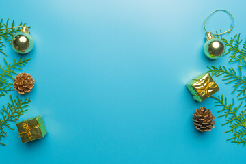 new year's card. toys and branches of thuja on a blue background. children's new year's theater