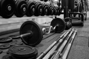 Dumbbells and kettlebells on a floor. Bodybuilding equipment. Fitness or bodybuilding concept...