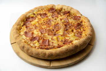 Hawaiian Pizza on cardboard box with bacon , cheese and pineapple on white background .Restaurant promotion concept on white background.
