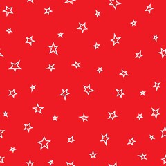 Seamless abstract pattern with white hand drawn shabby stars of different size on red background.