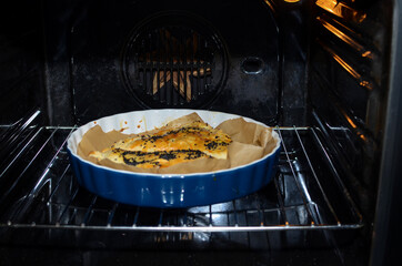 Home baked pies. Pies on a baking sheet in the oven.
