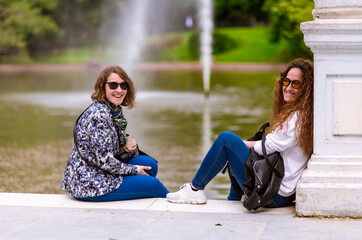 Mother and daughter talking sitting