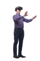 Excited man experiencing virtual reality via VR headset and touching something with his hands