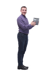 Businessman standing on white background with calculator