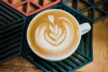 cup of coffee on wooden table