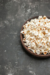 front view fresh popcorn on the dark background snack movie color darkness cinema corn