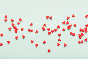 red and turquoise pattern background for Valentine's day. red hearts are evenly spread out on surface