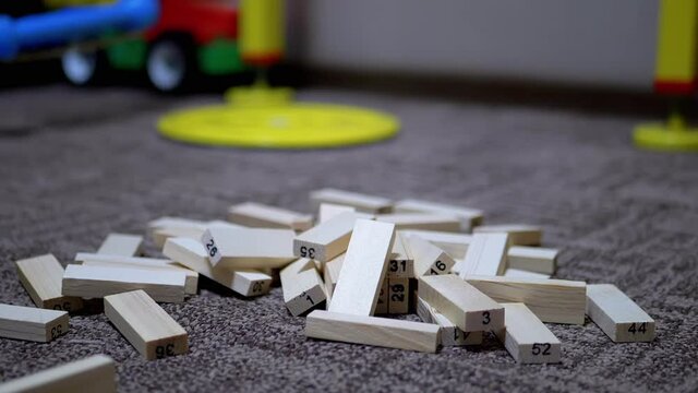 Falling Wooden Blocks of Tower Game. Slow motion. Close-Up