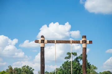 Swing pole with rope for swing and sky and cloud background