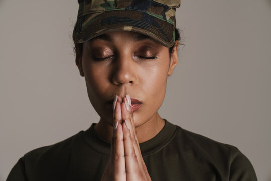 Calm African American Soldier Woman Holding Palms Together While Posing With Eyes Closed