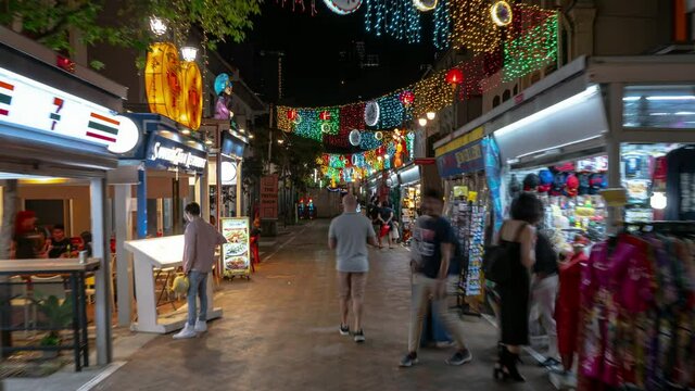 night time illuminated singapore city center famous china town crowded market street walking timelapse panorama 4k 