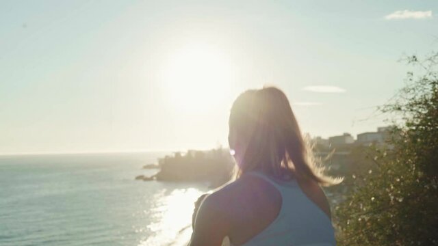 young spanish woman doing sport at the beach in the mediterranean sea