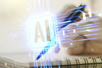 Double exposure of creative artificial Intelligence abbreviation with woman hand writing in notepad...
