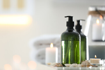 Soap dispensers and decor elements on table. Space for text