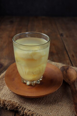 wedang tape or wedang tapai, traditional drink from fermented cassava doused with warm water then...