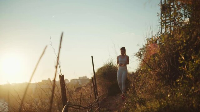 young spanish woman doing sport at the beach in the mediterranean sea