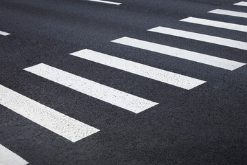pedestrian crossing, white stripes on black asphalt, road markings zebra crossing, place to cross...