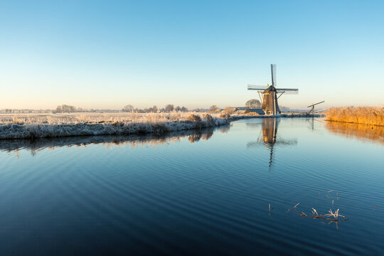Windmill 't Hoog- en Groenland with a refection in the Angstel river in the village Baambrugge in the Netherlands.