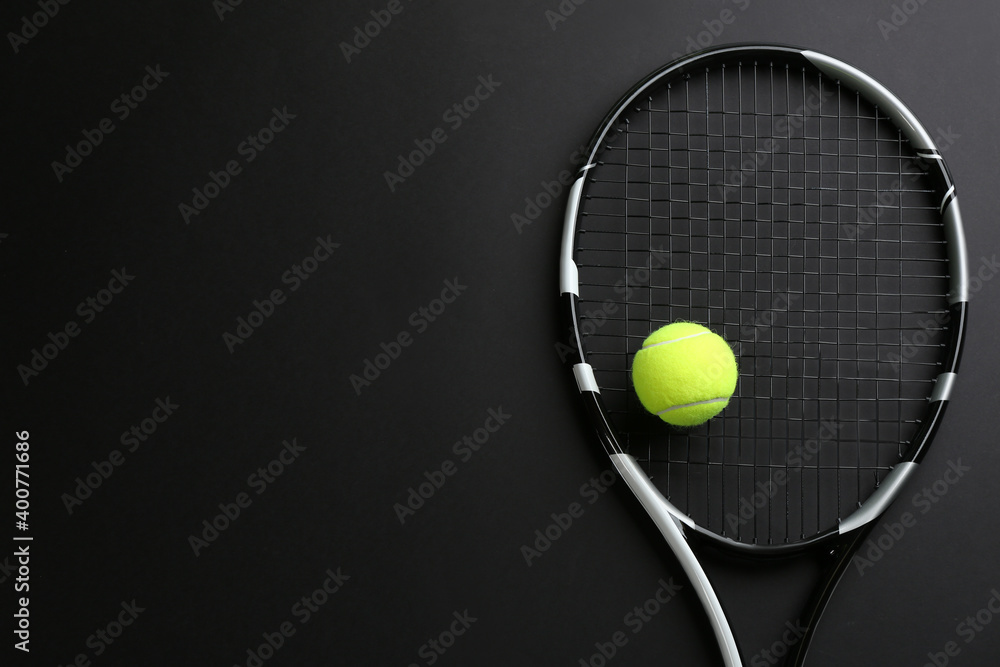 Poster Tennis racket and ball on black background, top view. Space for text