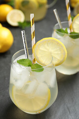 Natural lemonade with mint on grey table, closeup. Summer refreshing drink
