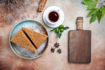 top view yummy honey cake with tea on a light background sweet biscuits cake sugar