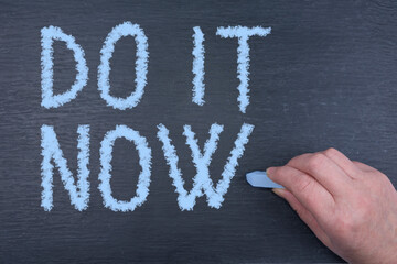 Motivational do it now sign on a chalkboard