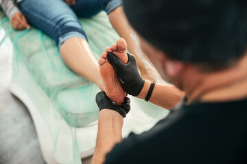 Close up of male hand massaging foot