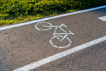 Fototapeta premium bike lane sign on the asphalt. Bike path