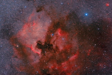 Deep space. Astrophotography of real space through a telescope. Clouds of cosmic hydrogen. NGC 7000. Real space objects.