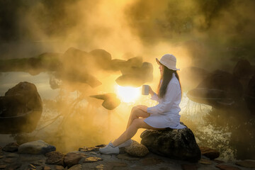 Woman sitting in the morning to relax.Young women drinking coffee on vacation.Women are relaxing in the morning.