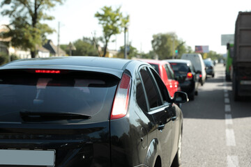 Fototapeta na wymiar Cars in traffic jam on city street
