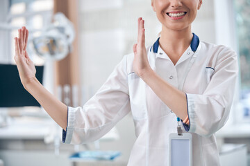 Smiling young woman working in dental clinic