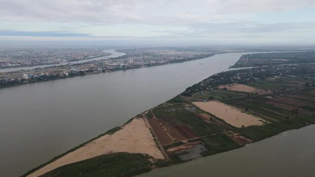 Aerial footage over Koh Okhna Tey island surrounded by the Mekong river and Koh Dach (Silk Island) in the background, Cambodia