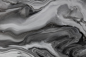 Fluid art texture. Backdrop with abstract iridescent paint effect. Liquid acrylic picture with flows and splashes. Mixed paints for website background. Black, white and gray overflowing colors
