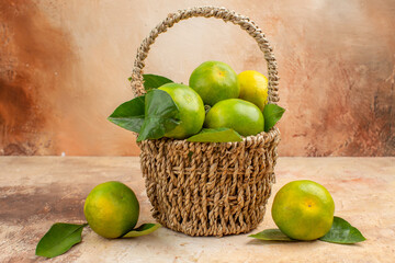 front view fresh green tangerines inside basket on the light background mellow fruit photo juice xmas color
