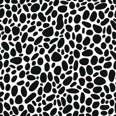 Randomly placed round elements to seamless pattern. Black and white dots like leo all over graphic.