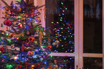 Christmas tree with fairy lights and mid century modern ornaments, glass spheres