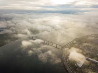 Aerial drone view. Railway bridge in Kiev, shrouded in morning fog.