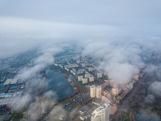 Aerial drone view. Low clouds over the Dnieper river in Kiev. Foggy autumn morning.