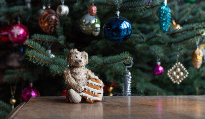 Vintage teddy bear with a pine shape gingerbread - christmas decoration